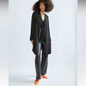 Aritzia Babaton Flowy Trench Coat. Colour is a taupe beige with olive undertones